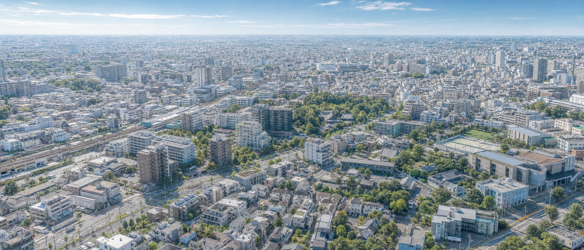 住宅と緑と交通が連なる都市の俯瞰イメージ